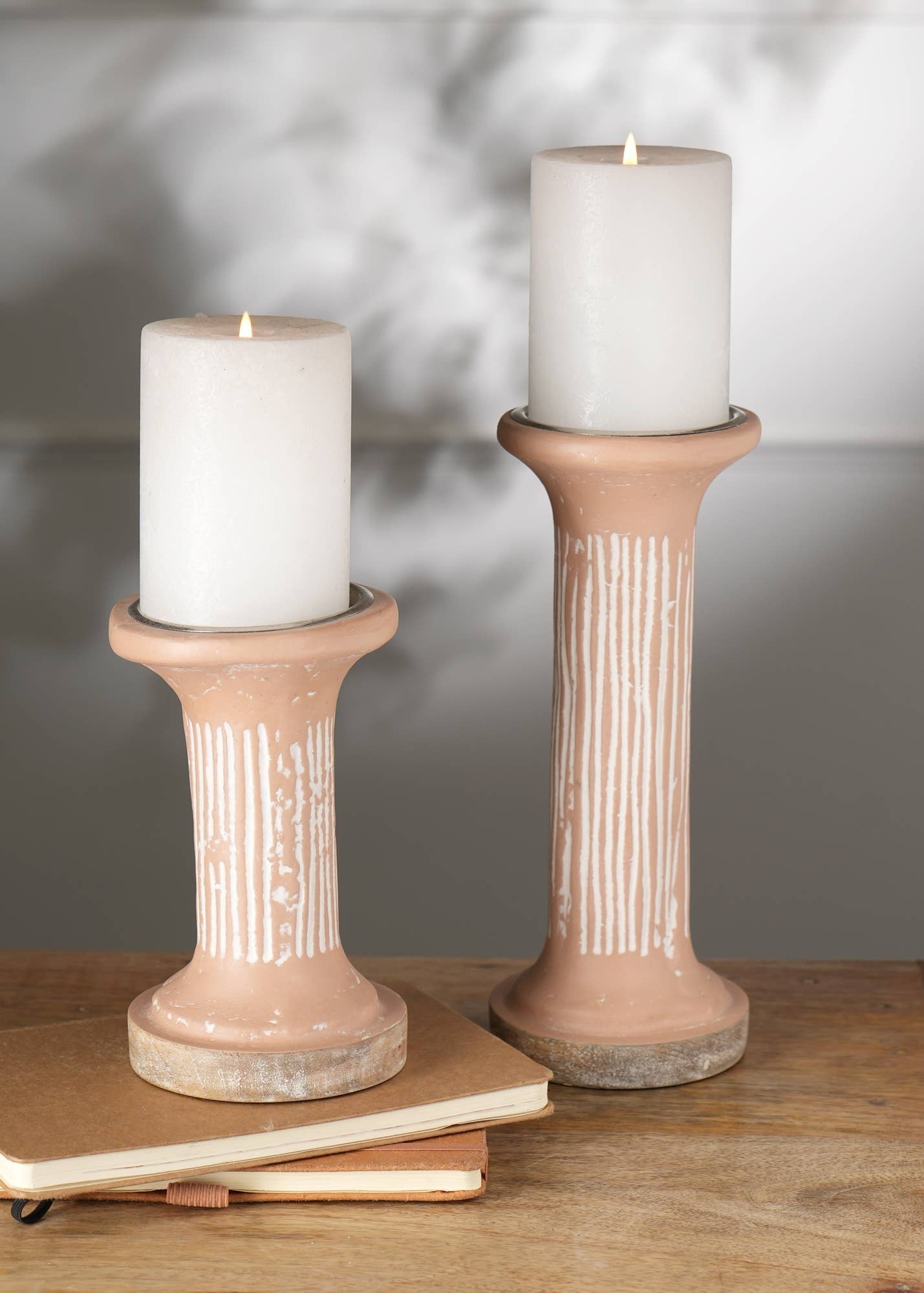 The candle holder that finishes the shelf.
