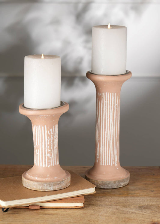 The candle holder that finishes the shelf.
